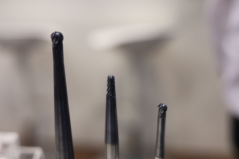Three ball end mills of different sizes