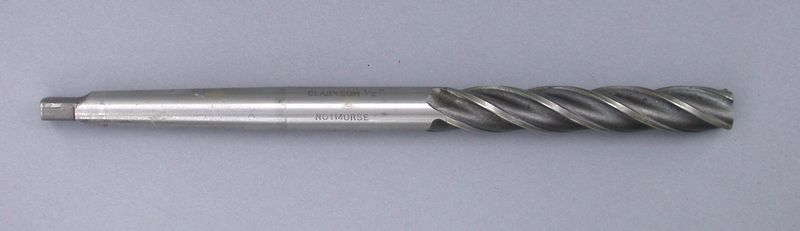 Machine reamer with spiral flutes